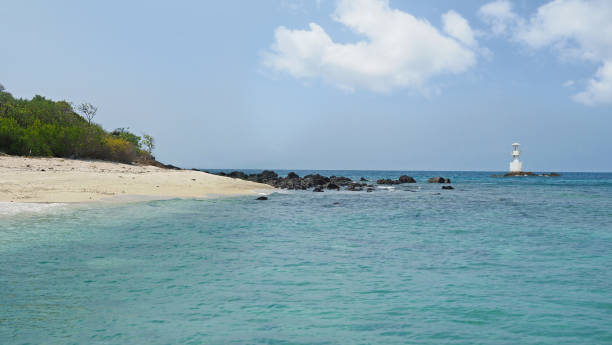 istock Beautiful seascape with an island and a white light house. 1130464807