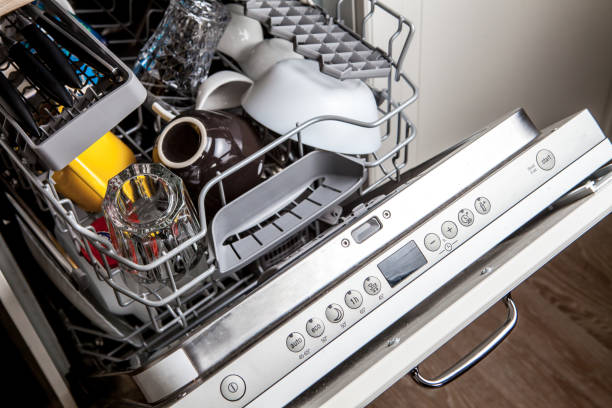Clean dishes in dishwasher machine after washing cycle Clean dishes in dishwasher machine after washing cycle dishwasher stock pictures, royalty-free photos & images