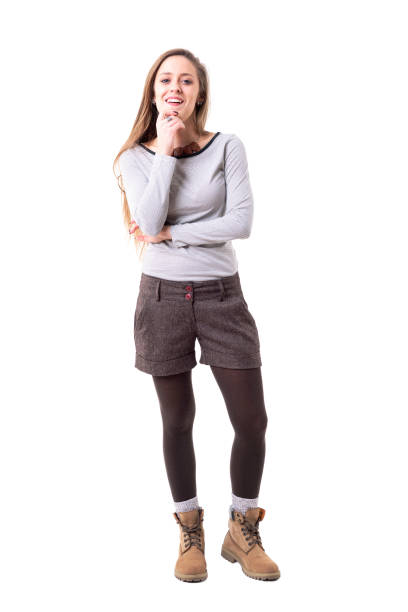 istock Satisfied young cute woman judging analyzing and smiling with approval and admiration looking at camera 1130468070