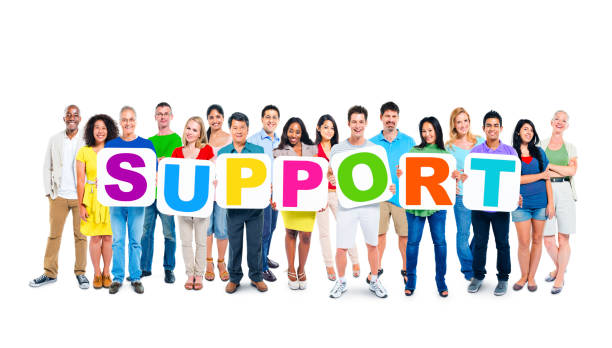 istock Multi-ethnic group of people holding 7 letters of placards forming support 1130468269