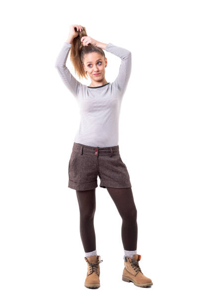 istock Funny expressive cute in retro styled clothes making hairdo herself. 1130468835