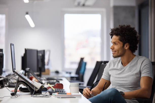 istock Businessman looking at laptop in office 1130470154