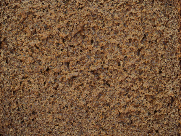 istock Rye bread with coriander texture, pulp crumb close-up baking dark background 1130470192