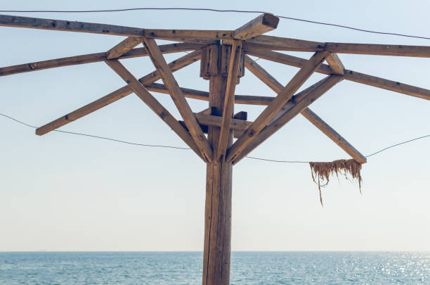 istock The frame of the old destroyed beach umbrella 1130470249