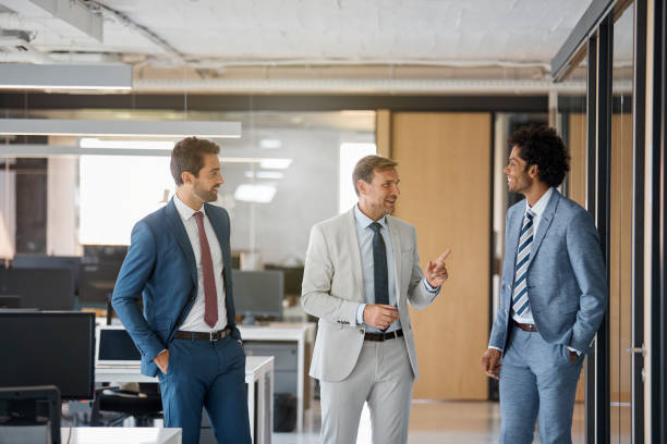 istock Businessman talking with colleague in office 1130470366