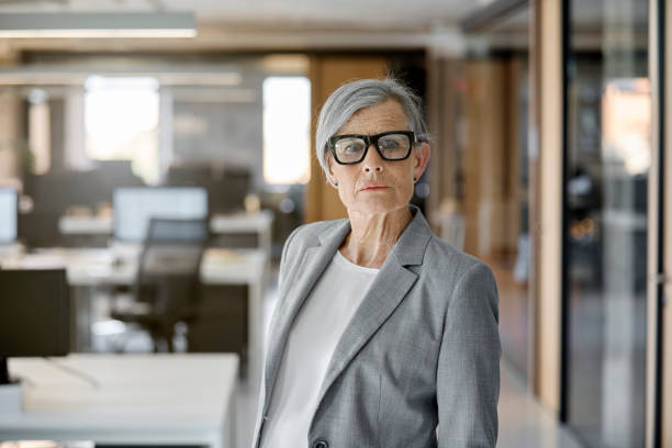 istock Confident senior businesswoman in office 1130470400