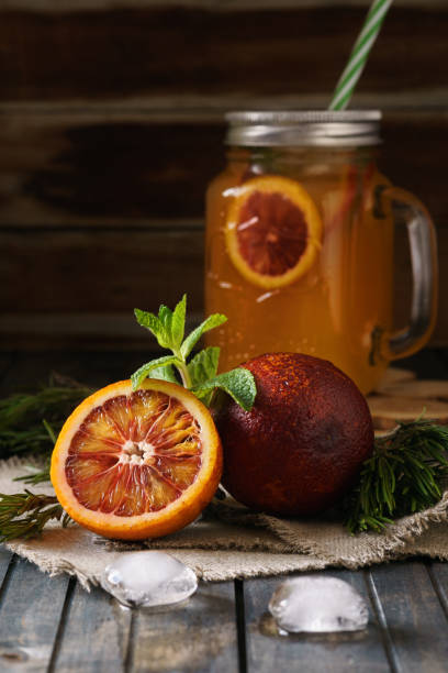 istock Blood orange juice in a mason jar with ice. Cold summer beverage 1130471951