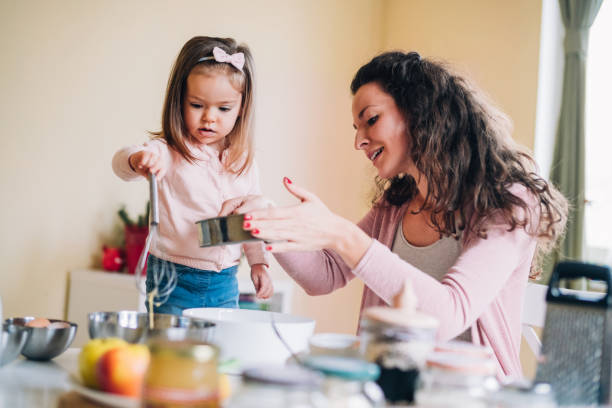 istock Happy mother and daughter in kitchen 1130472082