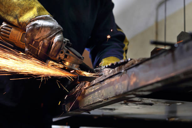 istock Grinding. The man polishes metal rods. 1130474855