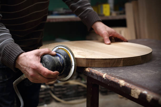 istock Grinding boards. carpenter polishes 1130475455