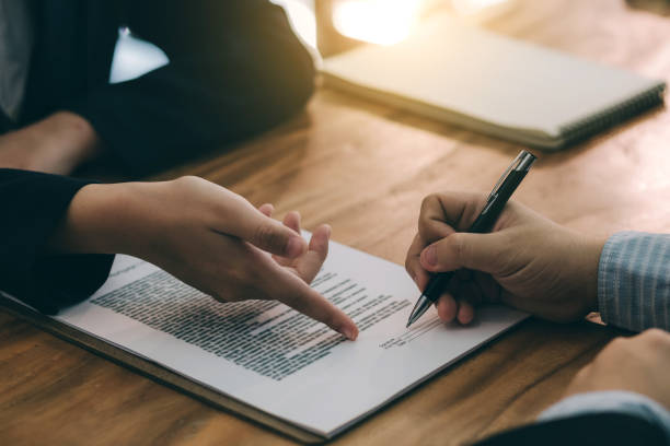 signing the agreement in the contract. - signature imagens e fotografias de stock