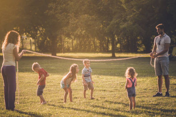 istock Group of children playing in public park 1130478422