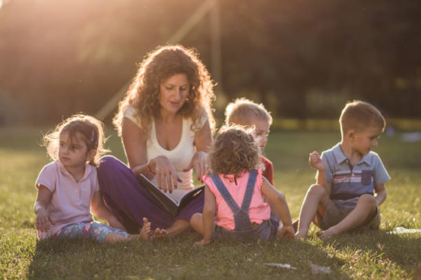 istock Group of happy children having fun in nature 1130478536