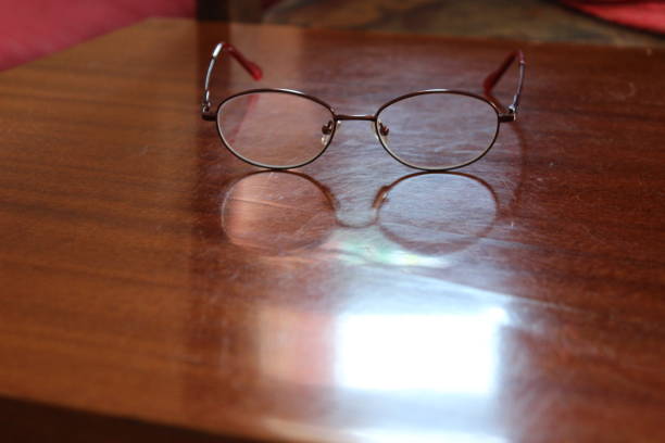 istock Reading glasses with mobile phone 1130478869