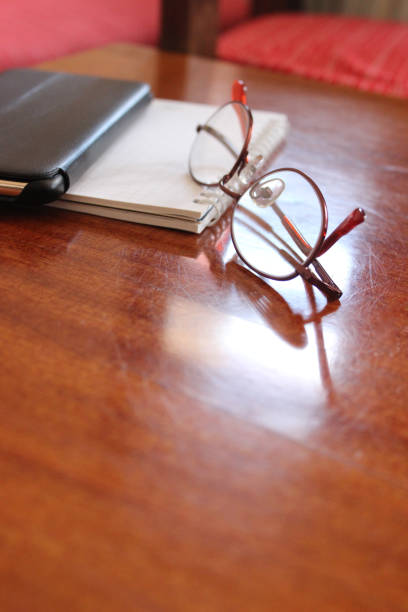 istock Reading glasses with mobile phone 1130478897