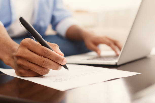 istock Financier making annual financial report using laptop 1130479288