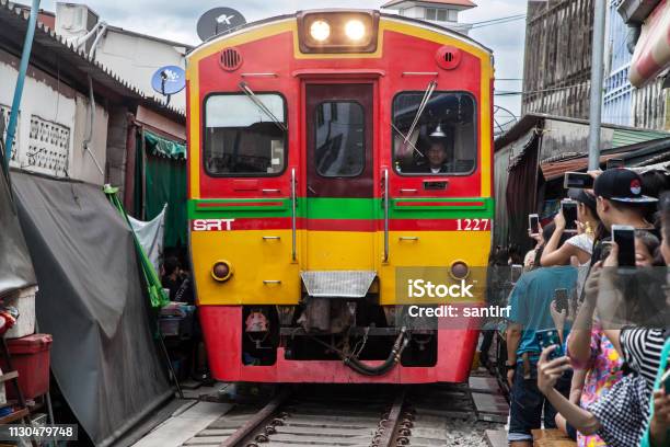 Train Crossing The Maeklong Market Stock Photo - Download Image Now - Market - Retail Space, Rail Transportation, Thailand