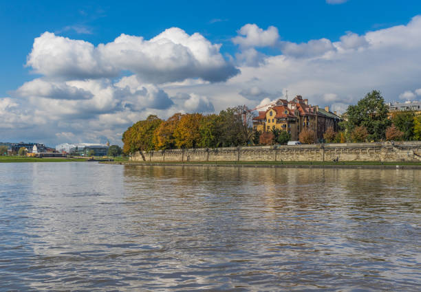 Krakow, Poland - the Vistula river cuts the city in two, and offers a great variety of bridges and historical landmarks, like churches and factories