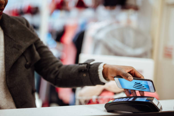 istock Contactless Payment with Mobile Phone in a shop 1130480903