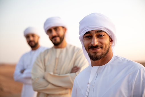 Arab friends out of Dubai desert for a weekend.\n\nNote For inspectors: PLEASE ACCEPT THIS ONE AND REJECT THE OTHER (SAME IMAGE). The guy has a scar given from the earring and it is against Islam.