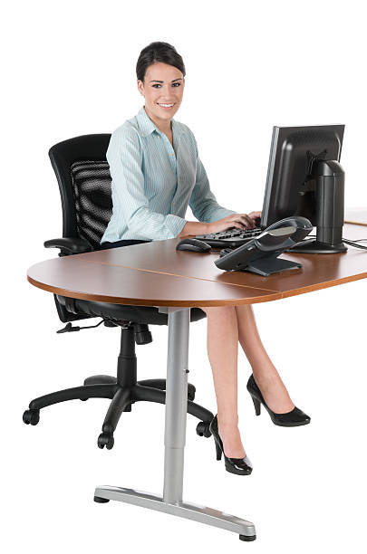 istock Young businesswoman typing at computer, isolated on white 113048292