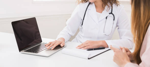 istock Doctor using laptop in office, making patient's anamnesis 1130483126