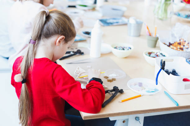 istock The girl is engaged in a ceramic mosaic workshop. 1130483496