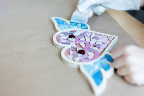 istock The process of creating a heart from a mosaic. 1130483601