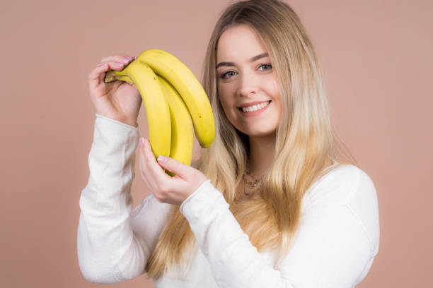 istock Girl with a banana 1130484884