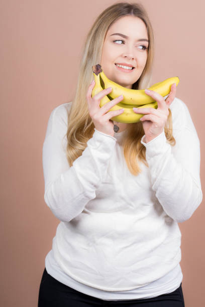 istock Girl with a banana 1130484990