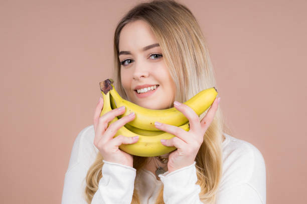 istock Girl with a banana 1130484992