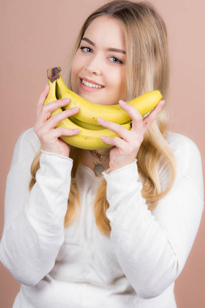 istock Girl with a banana 1130485001