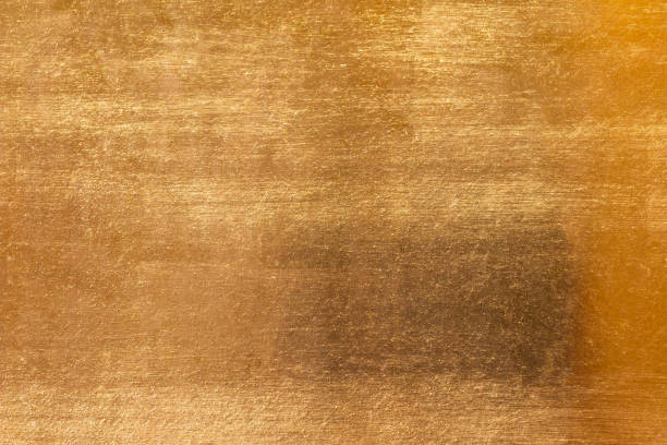 istock Shiny yellow leaf gold metall texture and background 1130485035
