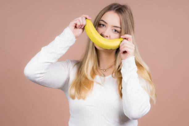 istock Girl with a banana 1130485043