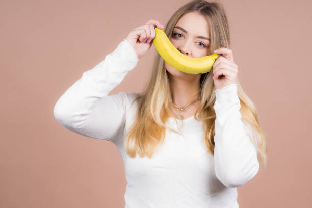 istock Girl with a banana 1130485049