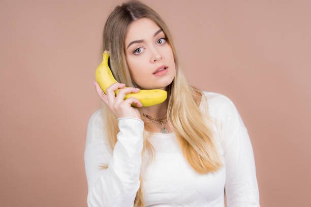 istock Girl with a banana 1130485086