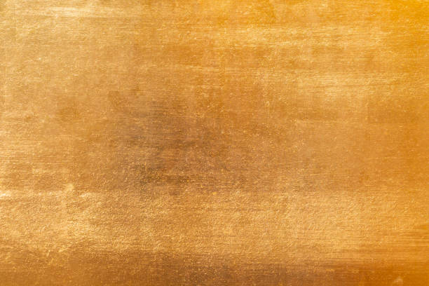 istock Shiny yellow leaf gold metall texture and background 1130485612