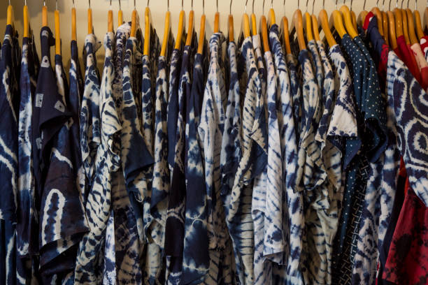istock Shirts on hangers in a shop 1130485665