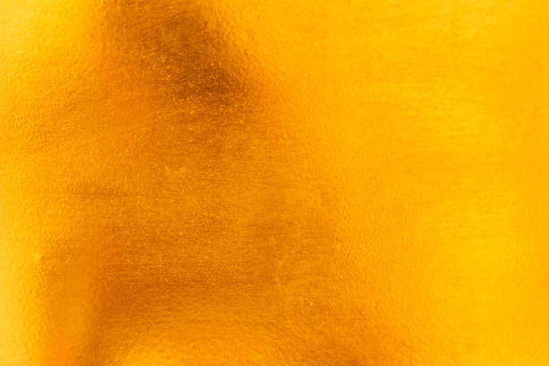 istock Shiny yellow leaf gold metall texture and background 1130487112