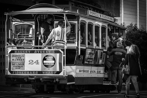 San Francisco, California - October 05 2017: Passengers getting onto Cable Car 24 in San Francisco, California.