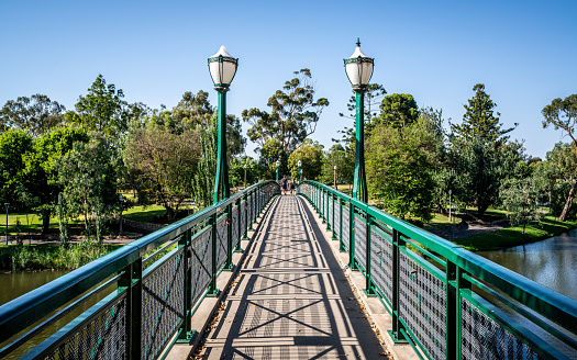 Old Albert bridge an heritage footbridge over Torrens River with street light in Adelaide SA Australia