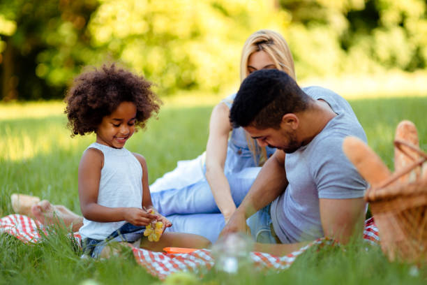 istock Happy family having fun time on picnic 1130490683