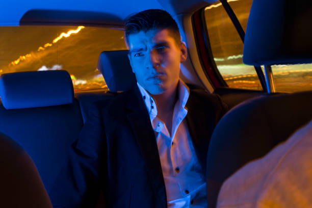istock Modern businessman in a taxi 1130490952