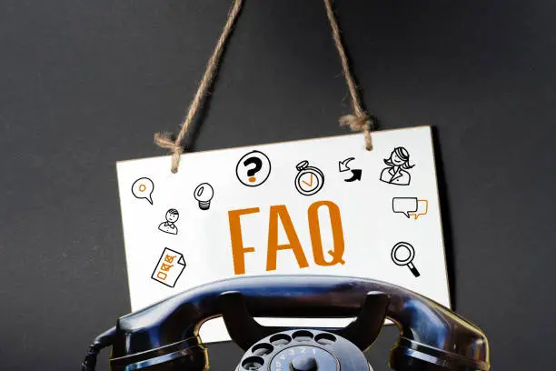 A phone and FAQ Frequently Asked Questions