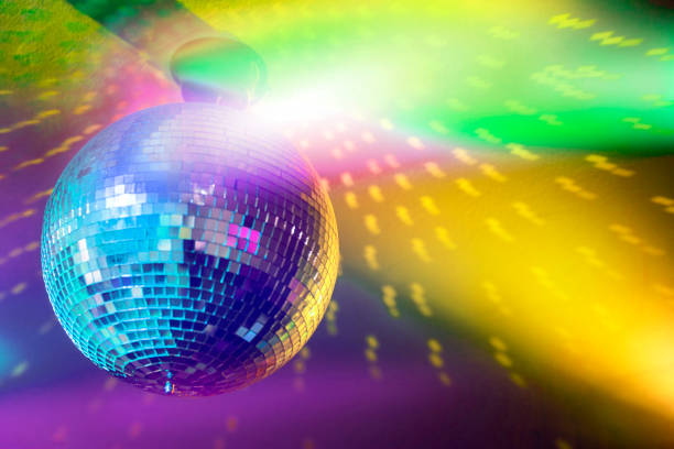 Disco ball Disco ball in a nightclub with colorful lights. disco lights stock pictures, royalty-free photos & images