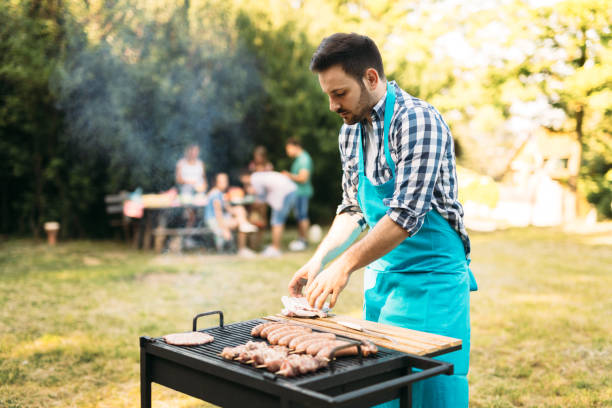 istock Happy male preparing bbq meat 1130491325