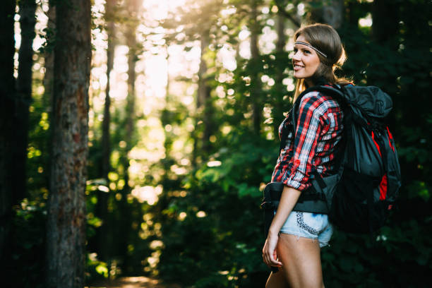 istock Female backpacker set out on forest trail 1130491410