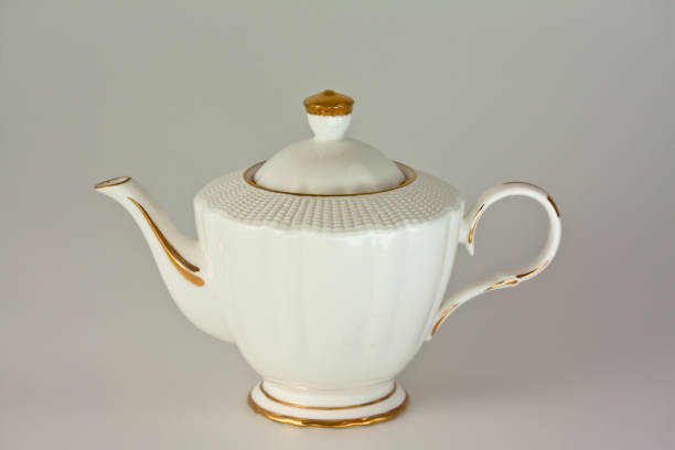 istock Beautiful white porcelain teapot on white background. 1130493170