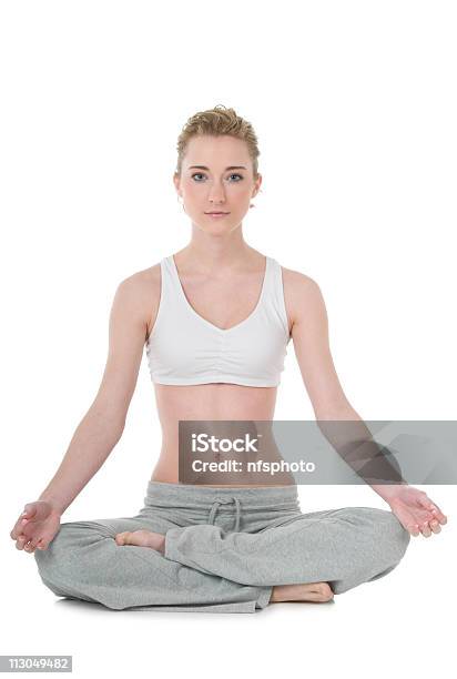 Young Woman Doing Yoga Easy Sukhasana Position Stock Photo - Download Image Now - 20-29 Years, Adult, Adults Only