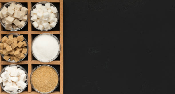 istock Various types of sugar on black background. 1130495490